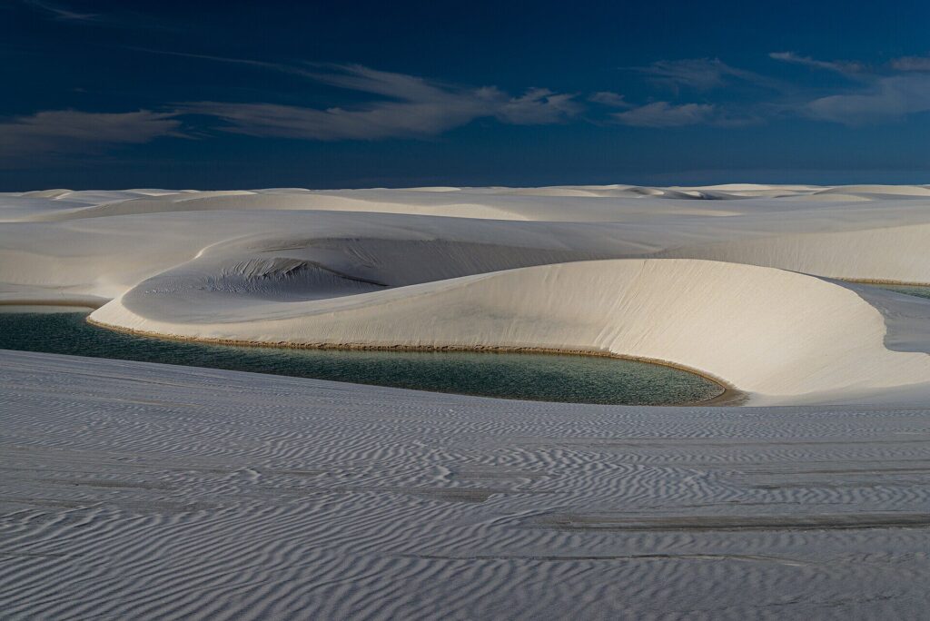 Blue freshwater lagoons between white sand dunes at Lençóis Maranhenses National Park