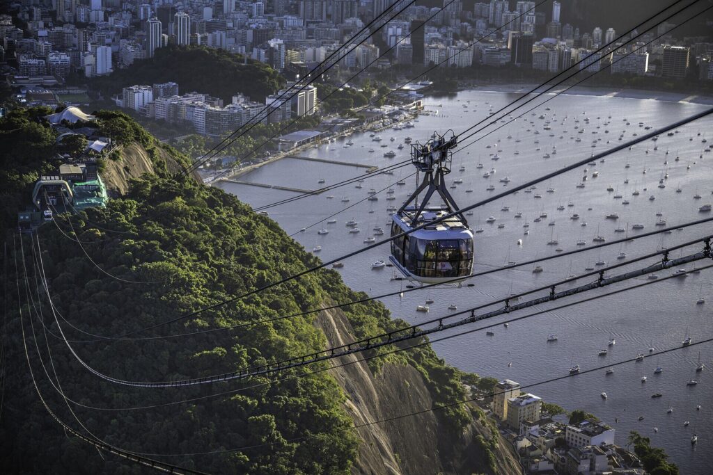Cable car climbing Sugarloaf Mountain above the bay in Rio de Janeiro
