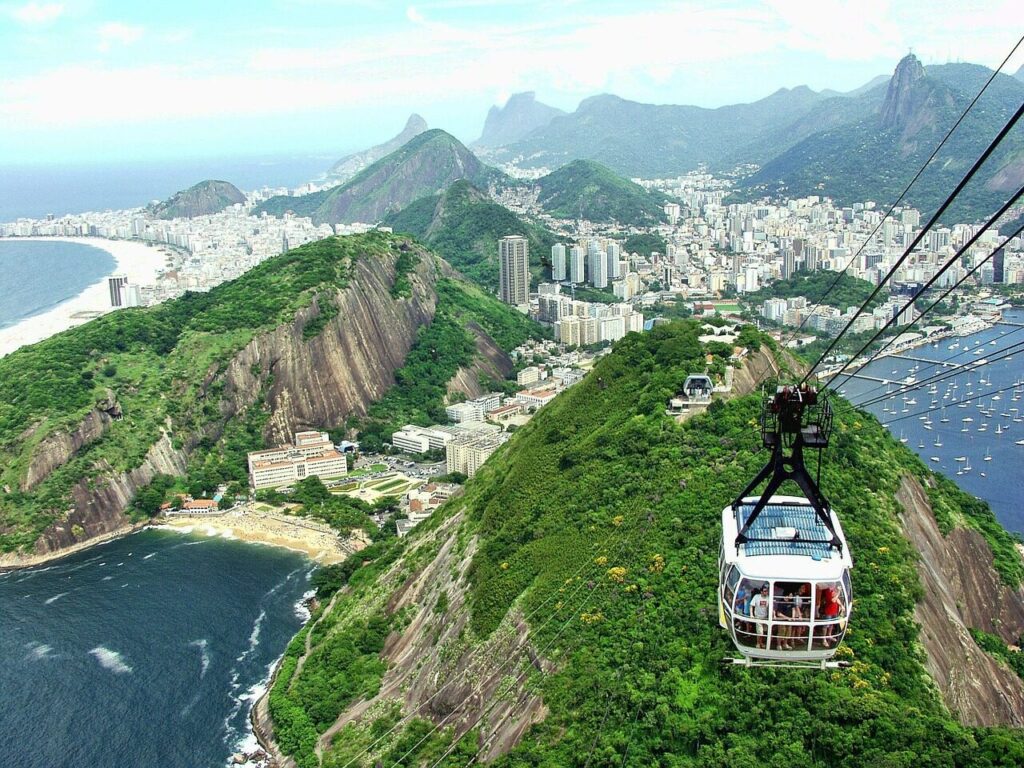 Cable car climbing toward Sugarloaf Mountain above Guanabara Bay in Rio