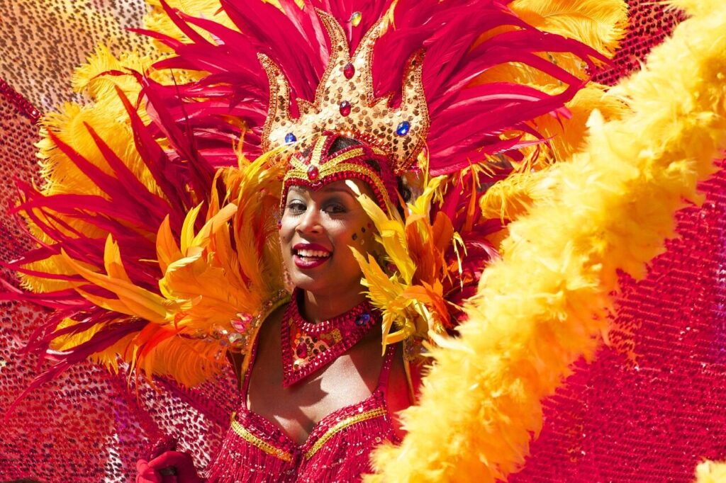 Carnival reveler wearing feathers and sequins at a Rio de Janeiro party