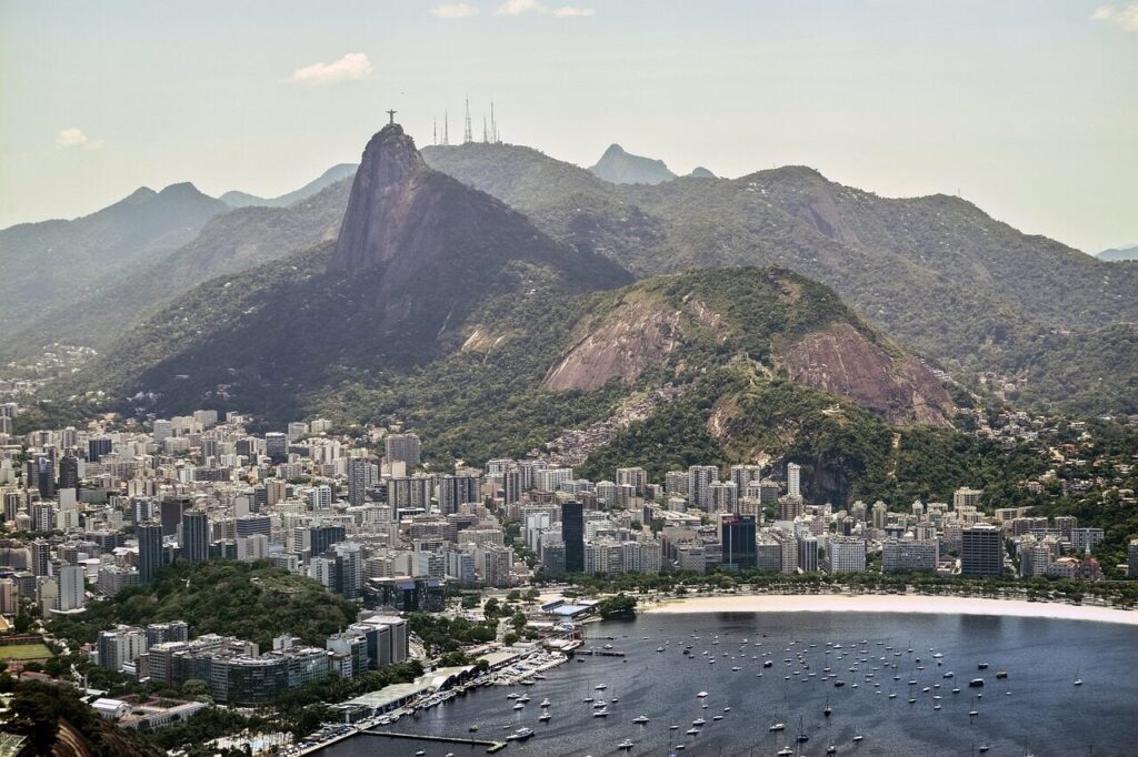 Christ the Redeemer statue with arms outstretched on Corcovado peak above Rio de Janeiro