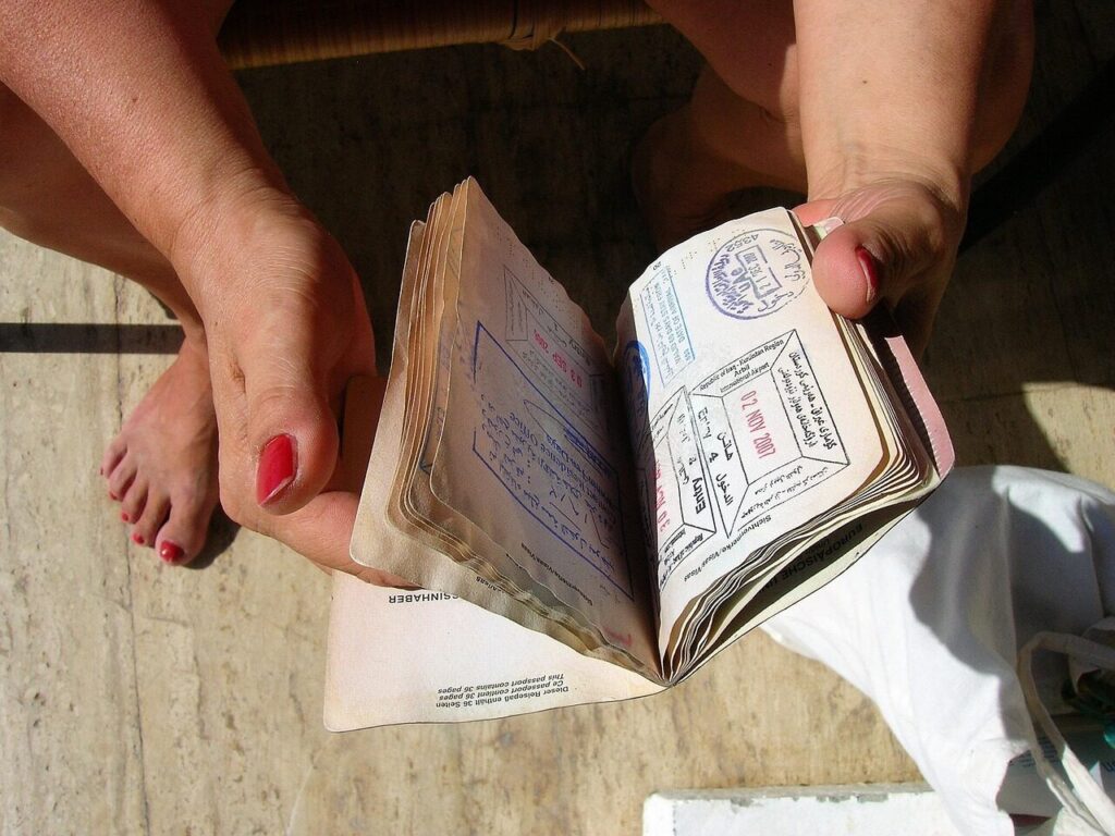 Close view of a passport page covered in immigration entry stamps