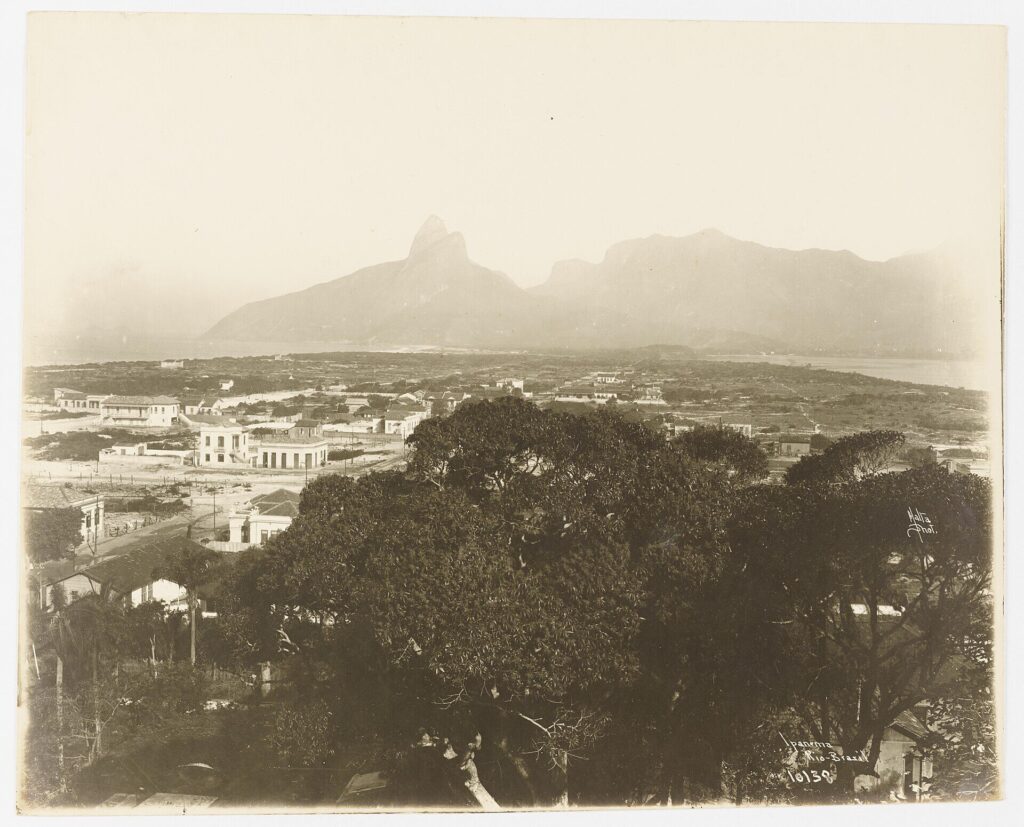 Ipanema beach with Two Brothers mountain behind and sunbathers on the sand in Rio