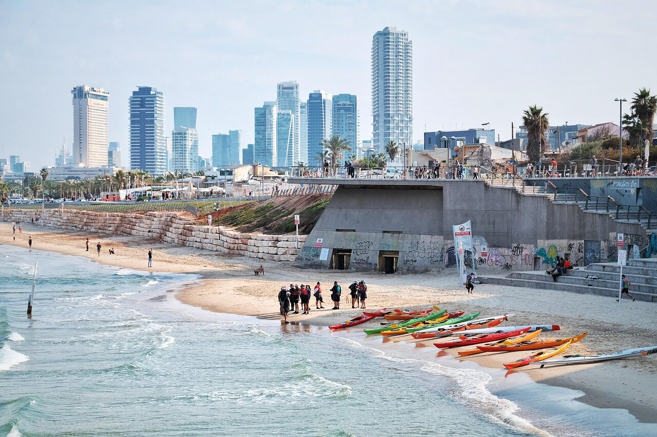 Is Brazil safe? Tourists walking along the Copacabana beachfront promenade in daylight