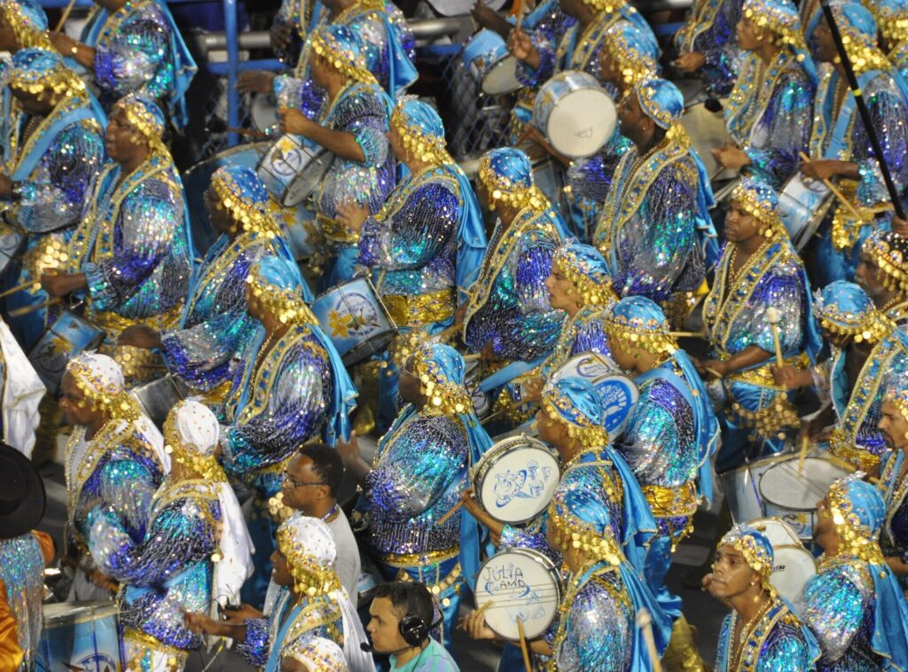 Samba school float and dancers parading through the Sambadrome during Rio Carnival