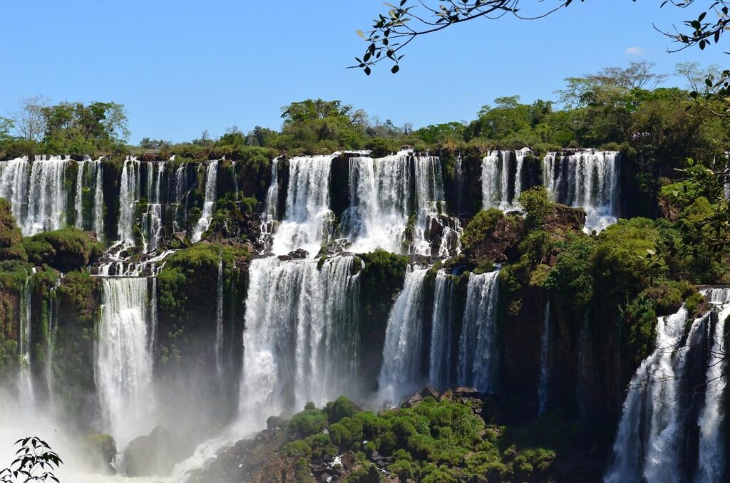 Visitors on a walkway above the thundering waterfalls at Iguazu Falls
