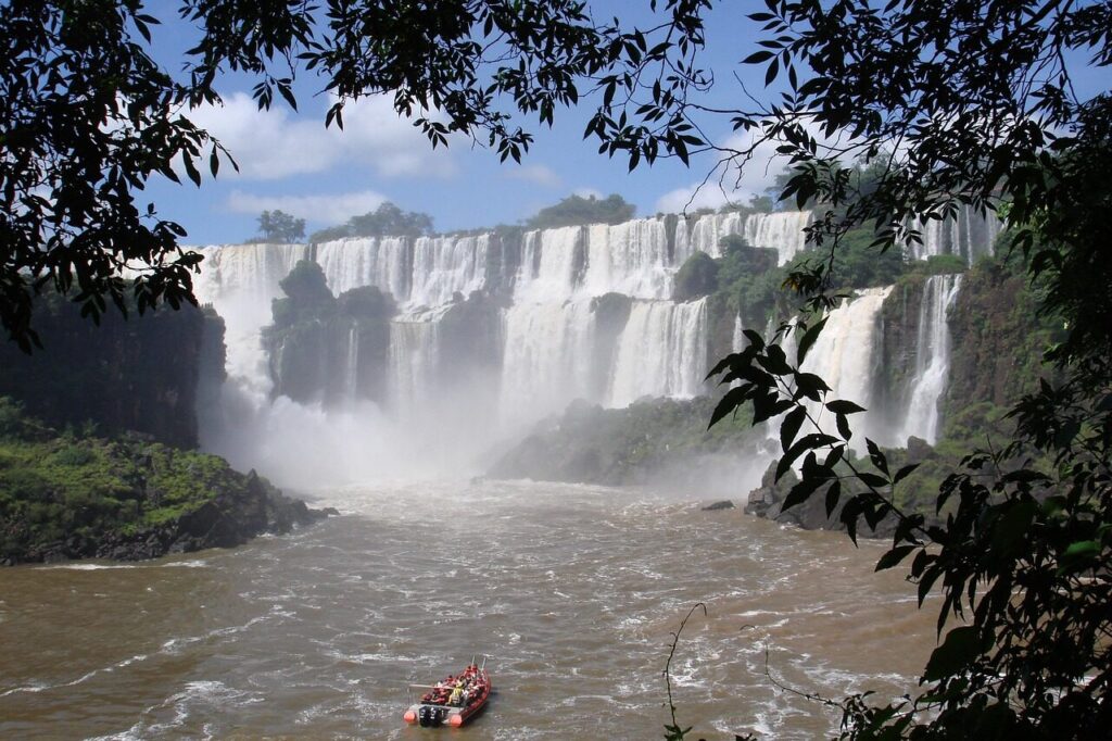 Visitors on the Devil's Throat walkway surrounded by mist at Iguazu Falls