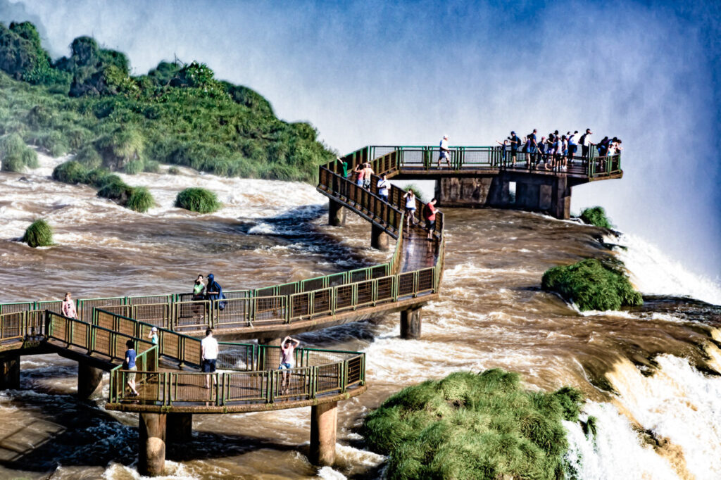 Visitors on the panoramic walkway facing the Iguazu Falls on the Brazilian side